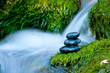 Pebble stones over waterfall