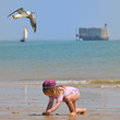 child playing at Island of Oleron - France child playing at Island of Oleron - France