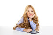 blond student kid with ebook tablet pc portrait in desk