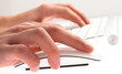 man typing with keyboard