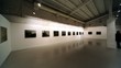 Few people at photography exhibition