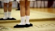 Little girl stand in front of mirror and make dance moves