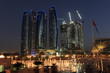 Skyscrapers in Abu Dhabi at dusk, United Arab Emirates Skyscrapers in Abu Dhabi at dusk, United Arab Emirates