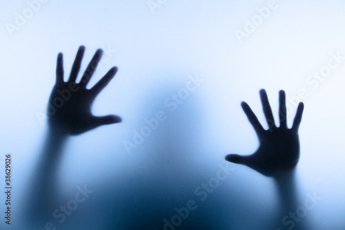 Photo: blur hand of man touching glass blur hand of man touching glass