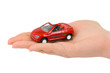 Hand and toy car
