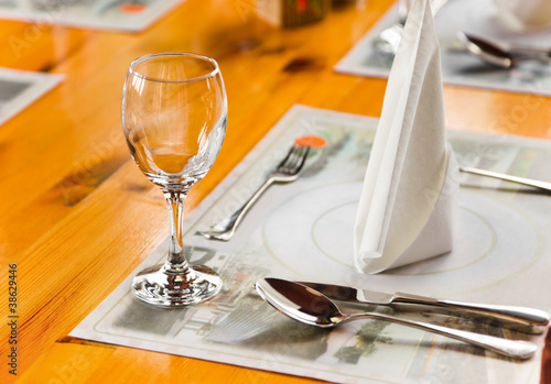 Photo: Glasse and plate on table in restaurant Glasse and plate on table in restaurant