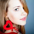 beautiful young blonde holding a red heart