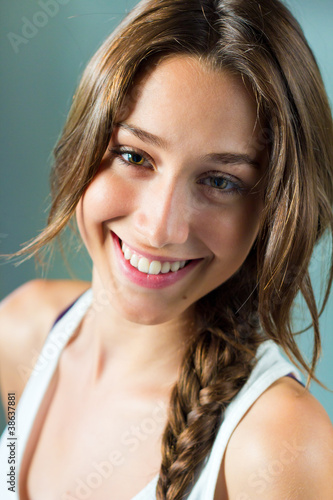 Photo: portrait of happy young woman at home portrait of happy young woman at home