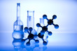 Glass laboratory equipment with blue background
