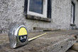 builders diy tape measure on scaffolding at building site