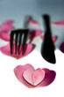 knife and fork with heart shaped rose petals