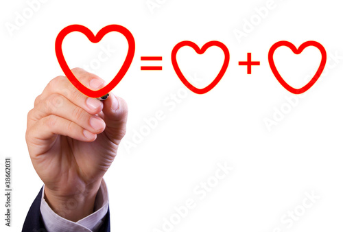 Photo: hand writing love mathematical equation of heart hand writing love mathematical equation of heart