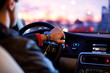 Driving a car at night - young man driving her car