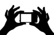 Foto: Photo camera in hands Photo camera in hands