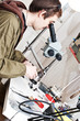 jeweller is working with  microscope