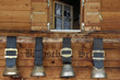 Photo: Swiss cow bells hanging outside traditional chalet Swiss cow bells hanging outside traditional chalet