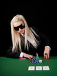 Sexy blond playing poker in Casino