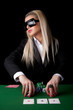 Sexy blond playing poker in Casino