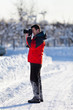 Tourist with camera in the winter Tourist with camera in the winter
