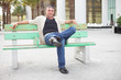 Man on a bus bench