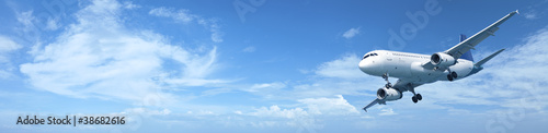 Photo: Panoramic composition of a jet aircraft in a blue sky Panoramic composition of a jet aircraft in a blue sky