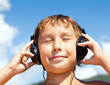 Boy listens to music on headphones