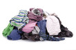 Big heap of colorful clothes isolated on white background