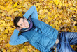 Photo: Young man sitting in park. Young man sitting in park.