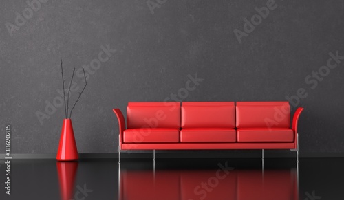 Photo: Wohndesign - rotes Sofa vor grauer Wand Wohndesign - rotes Sofa vor grauer Wand