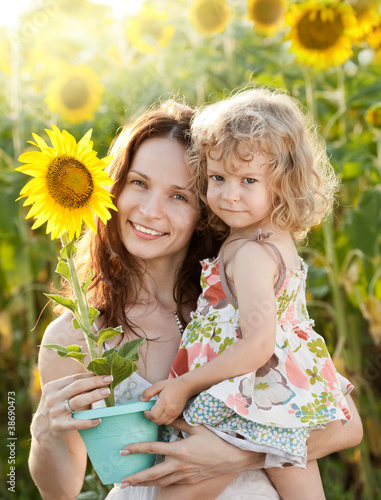 Photo: Woman and child with sunflower Woman and child with sunflower