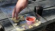 Shuffling Red Sauce And Chips In Plastic Carton Shuffling Red Sauce And Chips In Plastic Carton