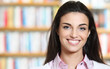 smiling young female showing a business card  -  copy space.