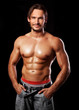 handsome powerful muscular man isolated on black