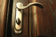 Photo: The iron doorhandle on the wooden doors close The iron doorhandle on the wooden doors close
