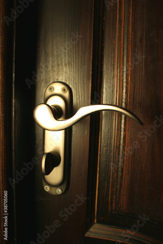 Photo: The iron doorhandle on the wooden doors close The iron doorhandle on the wooden doors close