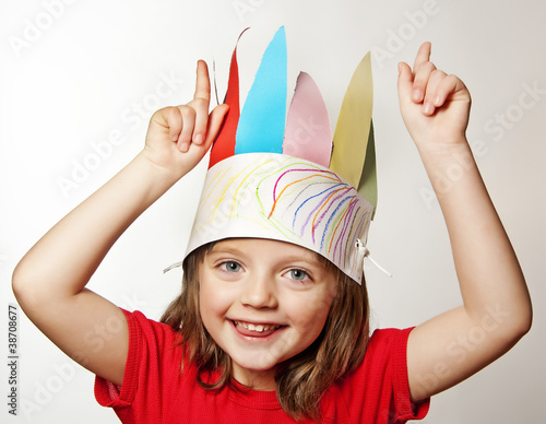 Photo: little girl with Indian headdress made of paper - carnival mask little girl with Indian headdress made of paper - carnival mask