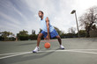 Basketball player dribbling the ball