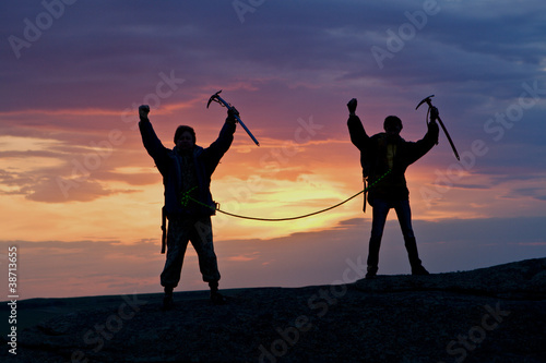 Photo: Two climbers connected by rope Two climbers connected by rope