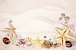 Sea shells, coral and stars with sand