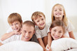 Happy family with children in bed