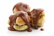 Photo: three profiteroles over white background three profiteroles over white background