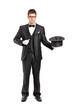 Magician holding a magic wand and top hat Magician holding a magic wand and top hat