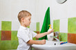 boy washes with hand soap.