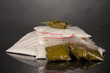 Cocaine and marihuana in packages on grey background