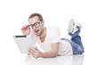 Smart Nerd Man With Tablet Computer lying on the floor Smart Nerd Man With Tablet Computer lying on the floor