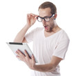 Surprised Nerd Man Looking at Tablet Computer Surprised Nerd Man Looking at Tablet Computer