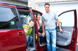 Happy family and a family car.