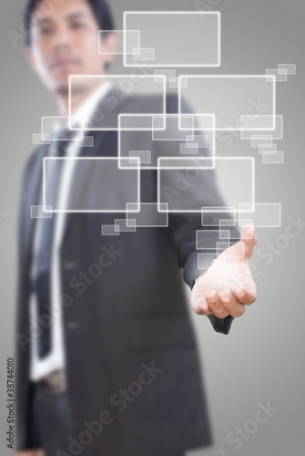 Photo: Businessman putting Button. Businessman putting Button.