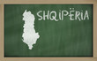 outline map of albania on blackboard