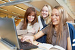 young student girls working with laptop in library